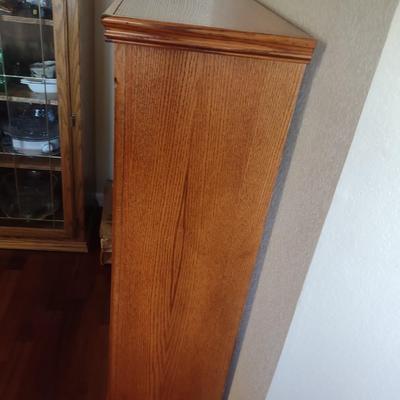 BOOKCASE WITH A VARIETY OF BOOKS