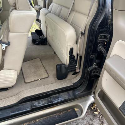 Sale Photo Thumbnail #5: 2004 Ford F150 Cobra Jet Lariat 5.4 Triton 64,500 miles! ﻿video of it running is on our Facebook page or can be sent upon request. You are able to come and view the truck as well. Battery is non functioning, requires a jump.