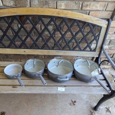 Sale Photo Thumbnail #221: bench in the background is not part of the lot this is for the cookware only