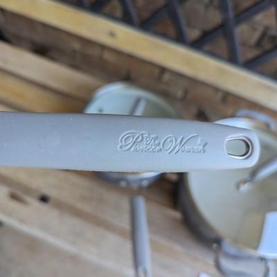 Sale Photo Thumbnail #227: bench in the background is not part of the lot this is for the cookware only