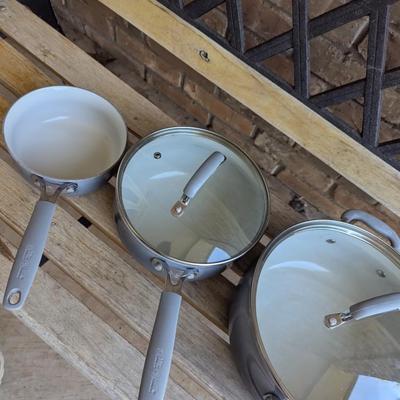 Sale Photo Thumbnail #225: bench in the background is not part of the lot this is for the cookware only