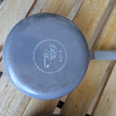 Sale Photo Thumbnail #228: bench in the background is not part of the lot this is for the cookware only