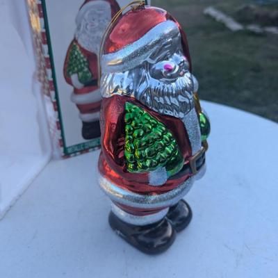 Sale Photo Thumbnail #305: Metallic Ceramic Santa figurine  see photos for size.  it might be a little bigger than you expect,. not an ornament size more like the height of an insulated cup.