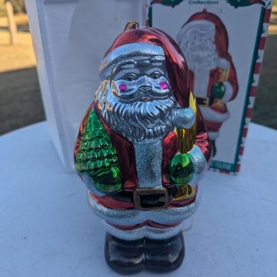Sale Photo Thumbnail #304: Metallic Ceramic Santa figurine  see photos for size.  it might be a little bigger than you expect,. not an ornament size more like the height of an insulated cup.