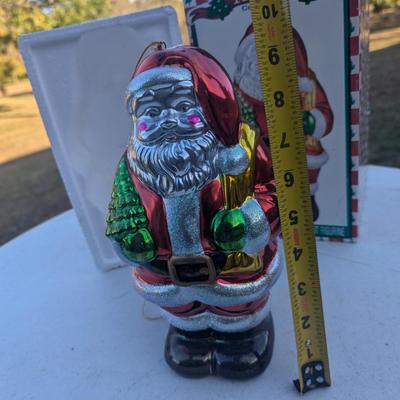 Sale Photo Thumbnail #309: Metallic Ceramic Santa figurine  see photos for size.  it might be a little bigger than you expect,. not an ornament size more like the height of an insulated cup.