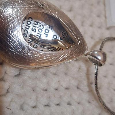 Sale Photo Thumbnail #592: Necklace- long necklace, silver tone with pendant