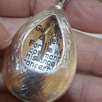 Sale Photo Thumbnail #589: Necklace- long necklace, silver tone with pendant