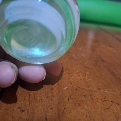 Sale Photo Thumbnail #730: blown glass paperweight, green and white flower