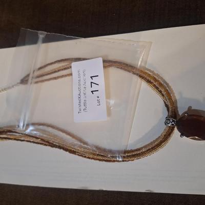 Sale Photo Thumbnail #946: Necklace with silver tone and blue stone pendant