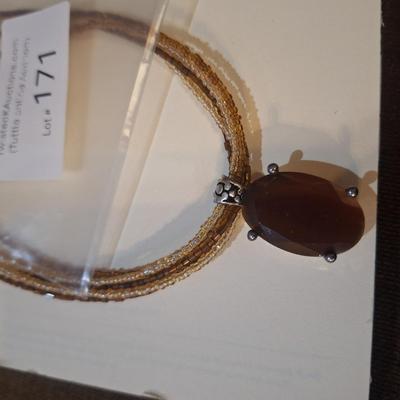 Sale Photo Thumbnail #947: Necklace with silver tone and blue stone pendant