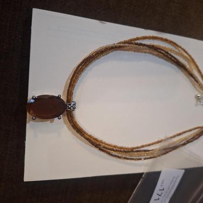 Sale Photo Thumbnail #949: Necklace with silver tone and blue stone pendant