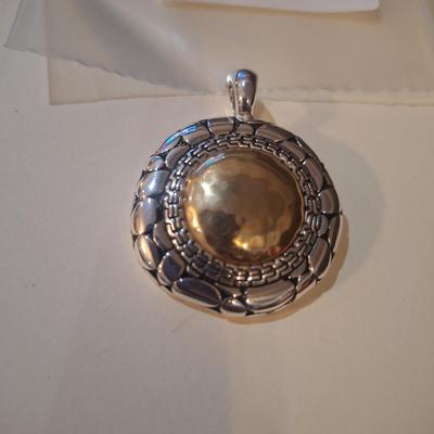 Sale Photo Thumbnail #954: round gold and silver tone pendant statement piece