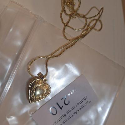 Sale Photo Thumbnail #1069: gold tone heart locket on chain