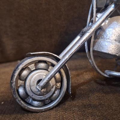 Sale Photo Thumbnail #1087: Miniature motorcycle sculpture made from various recycled items