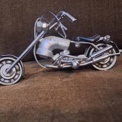 Sale Photo Thumbnail #1085: Miniature motorcycle sculpture made from various recycled items