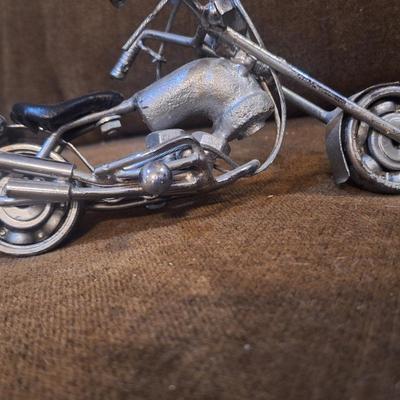 Sale Photo Thumbnail #1089: Miniature motorcycle sculpture made from various recycled items