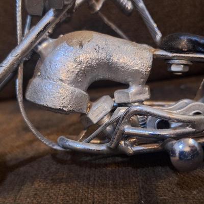 Sale Photo Thumbnail #1086: Miniature motorcycle sculpture made from various recycled items