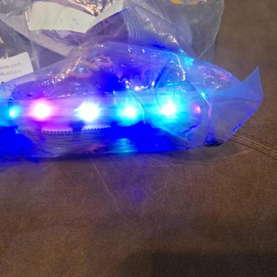 Sale Photo Thumbnail #1284: these show a 20 on the bottom so that would be the EU size.- we recommend you research the size cross reference yourself but it looks like they fit probably a 12 month old   they are new, pink with butterfly.