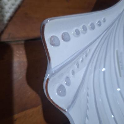 Sale Photo Thumbnail #1422: according to AI this is made in Portugal but we don't see that marked on it anywhere.  It does have the look of clay pottery that has been covered in white.