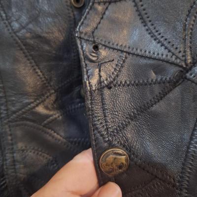 Sale Photo Thumbnail #1480: this is a personalized jacket.  It also has some damage, notice that the top buffalo snap is missing the cover, the lace on the sides has damage.  There may be other damage, please review the photos yourself for condition. This is leather.