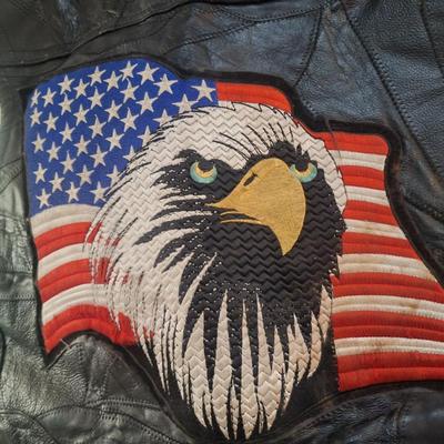 Sale Photo Thumbnail #1487: this is a personalized jacket.  It also has some damage, notice that the top buffalo snap is missing the cover, the lace on the sides has damage.  There may be other damage, please review the photos yourself for condition. This is leather.