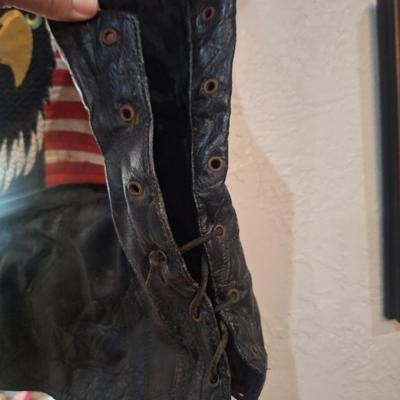 Sale Photo Thumbnail #1488: this is a personalized jacket.  It also has some damage, notice that the top buffalo snap is missing the cover, the lace on the sides has damage.  There may be other damage, please review the photos yourself for condition. This is leather.