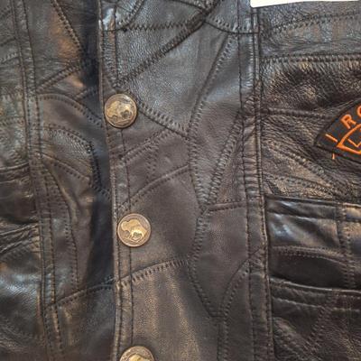 Sale Photo Thumbnail #1481: this is a personalized jacket.  It also has some damage, notice that the top buffalo snap is missing the cover, the lace on the sides has damage.  There may be other damage, please review the photos yourself for condition. This is leather.
