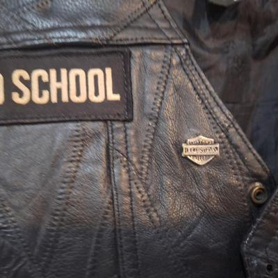 Sale Photo Thumbnail #1485: this is a personalized jacket.  It also has some damage, notice that the top buffalo snap is missing the cover, the lace on the sides has damage.  There may be other damage, please review the photos yourself for condition. This is leather.