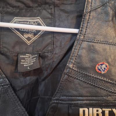 Sale Photo Thumbnail #1482: this is a personalized jacket.  It also has some damage, notice that the top buffalo snap is missing the cover, the lace on the sides has damage.  There may be other damage, please review the photos yourself for condition. This is leather.