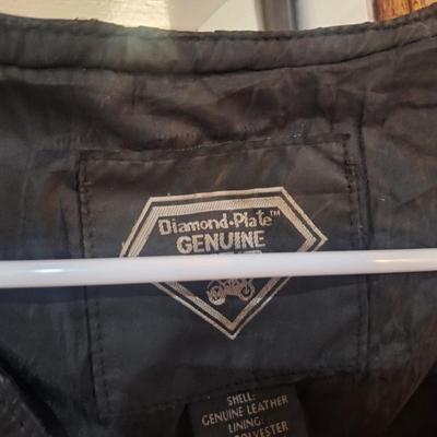 Sale Photo Thumbnail #1484: this is a personalized jacket.  It also has some damage, notice that the top buffalo snap is missing the cover, the lace on the sides has damage.  There may be other damage, please review the photos yourself for condition. This is leather.