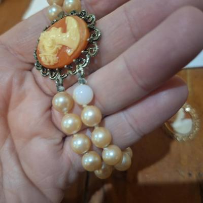 Sale Photo Thumbnail #1517: these are not pearls, notice in one photos there is one faux pearl with the coating wearing off.