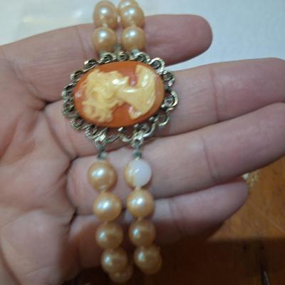 Sale Photo Thumbnail #1516: these are not pearls, notice in one photos there is one faux pearl with the coating wearing off.