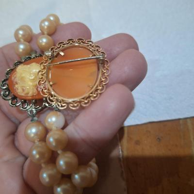 Sale Photo Thumbnail #1519: these are not pearls, notice in one photos there is one faux pearl with the coating wearing off.