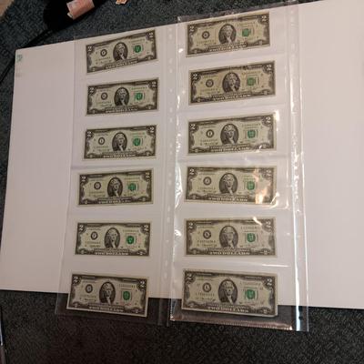 TWELVE $2 DOLLAR BILLS