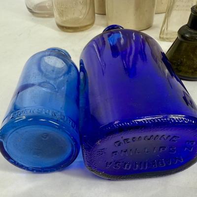 Sale Photo Thumbnail #291: Blue, smoky and clear glass and milk bottle.  See photos for what's included.