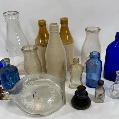 Sale Photo Thumbnail #300: Blue, smoky and clear glass and milk bottle.  See photos for what's included.