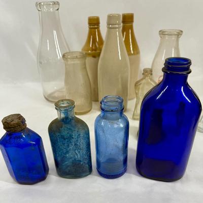 Sale Photo Thumbnail #293: Blue, smoky and clear glass and milk bottle.  See photos for what's included.