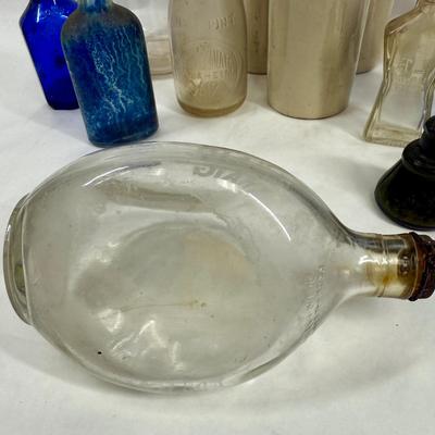 Sale Photo Thumbnail #297: Blue, smoky and clear glass and milk bottle.  See photos for what's included.