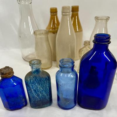 Sale Photo Thumbnail #294: Blue, smoky and clear glass and milk bottle.  See photos for what's included.