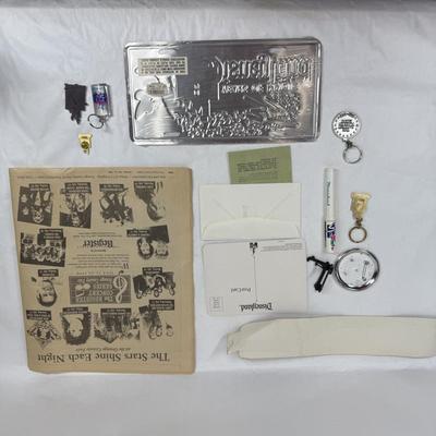 Sale Photo Thumbnail #144: Collectible lot includes newspaper handout, pin-on button, license plate, key fobs, pen, number sticker, and more. See photos for what's included.