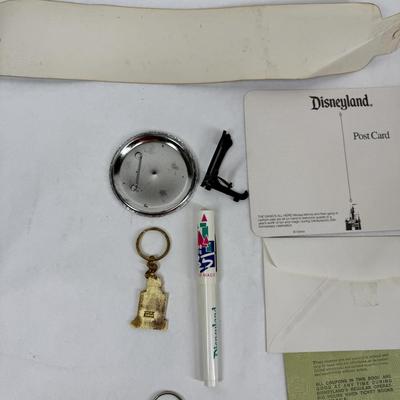 Sale Photo Thumbnail #143: Collectible lot includes newspaper handout, pin-on button, license plate, key fobs, pen, number sticker, and more. See photos for what's included.