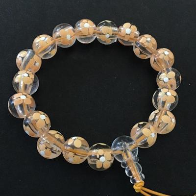 Cute peach colored flower beaded stretch bracelet