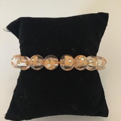 Cute peach colored flower beaded stretch bracelet