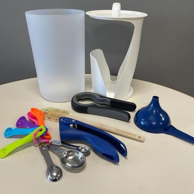 Kitchen utensils and Tupperware bagel keeper