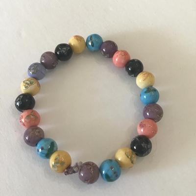 Pretty beaded stretch bracelet with butterfly & floral designs
