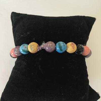 Pretty beaded stretch bracelet with butterfly & floral designs