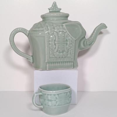 LOT 21: Celadon-Tone Elephant Teapot with Cup, Toyo Peacock Plate, Macau Made Enameled Dish & More