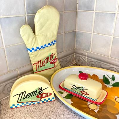 LOT 48: Kitchen Essentials - The Premier Woman Measuring Cups, Mom's Diner Napkin Holder / Butter Dish, Canisters, Towels and More