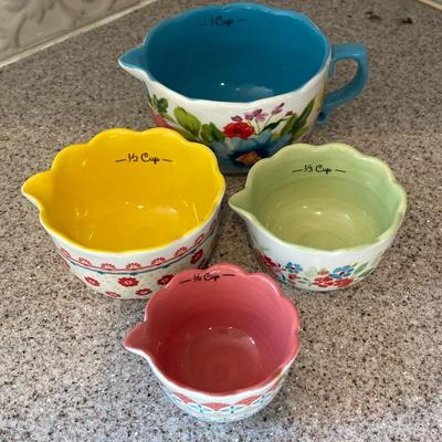 LOT 48: Kitchen Essentials - The Premier Woman Measuring Cups, Mom's Diner Napkin Holder / Butter Dish, Canisters, Towels and More