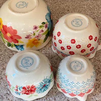 LOT 48: Kitchen Essentials - The Premier Woman Measuring Cups, Mom's Diner Napkin Holder / Butter Dish, Canisters, Towels and More